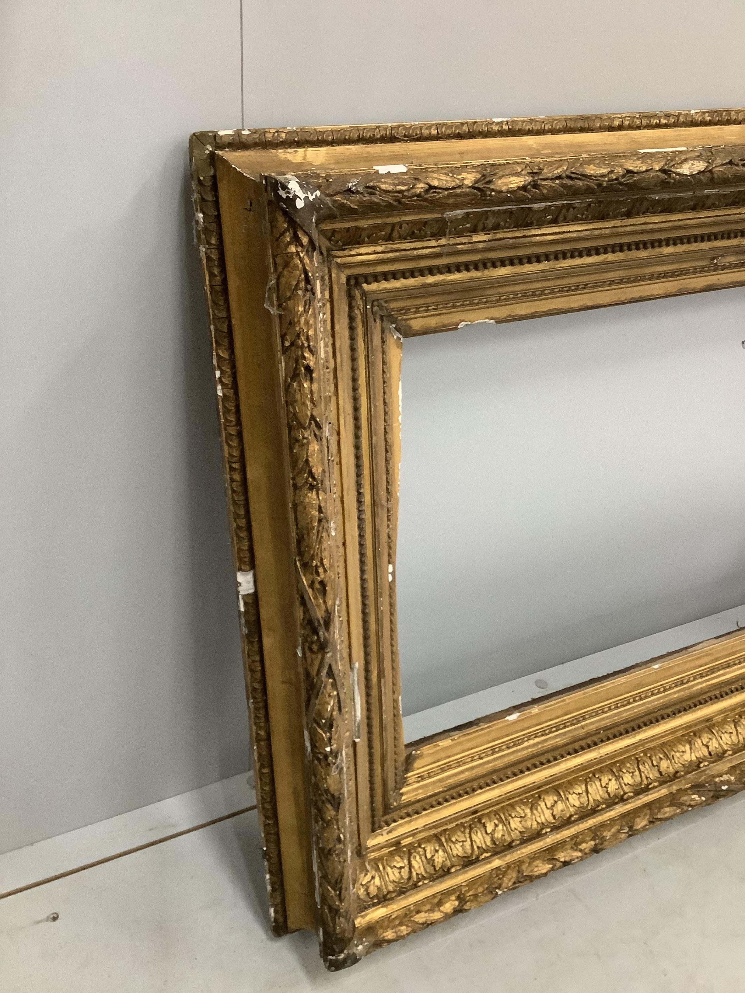 A Victorian rectangular giltwood and composition picture frame, width 73cm, height 105cm